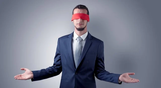 businessman with a blindfold representing blind recruitment