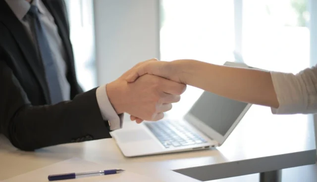 two people shaking hands after recruitment phase