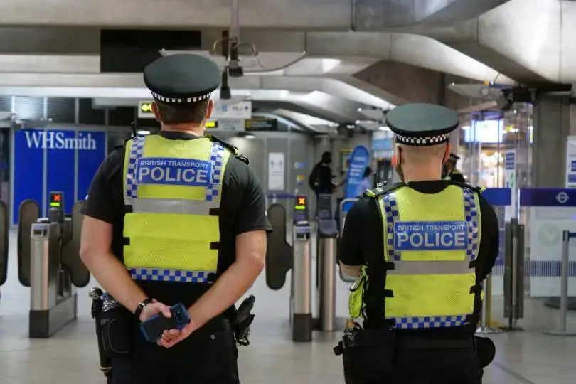 British Transport Police officers with backs to the camera